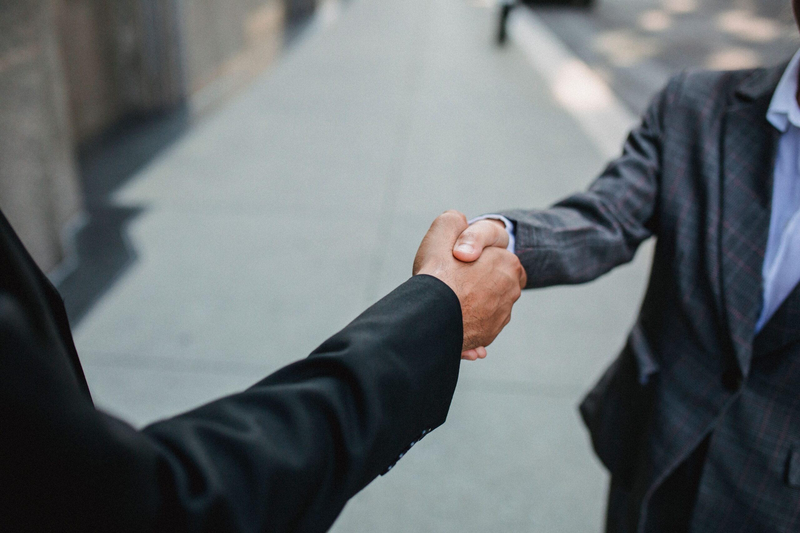 Two people shaking hands.